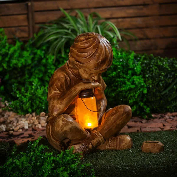 Boy with Firefly Statue